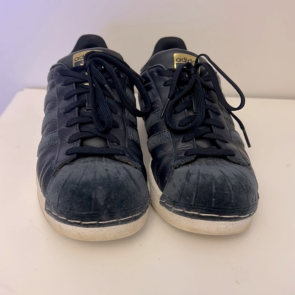 Navy blue leather/suede Adidas Superstars in women’s size 9 and 1/2